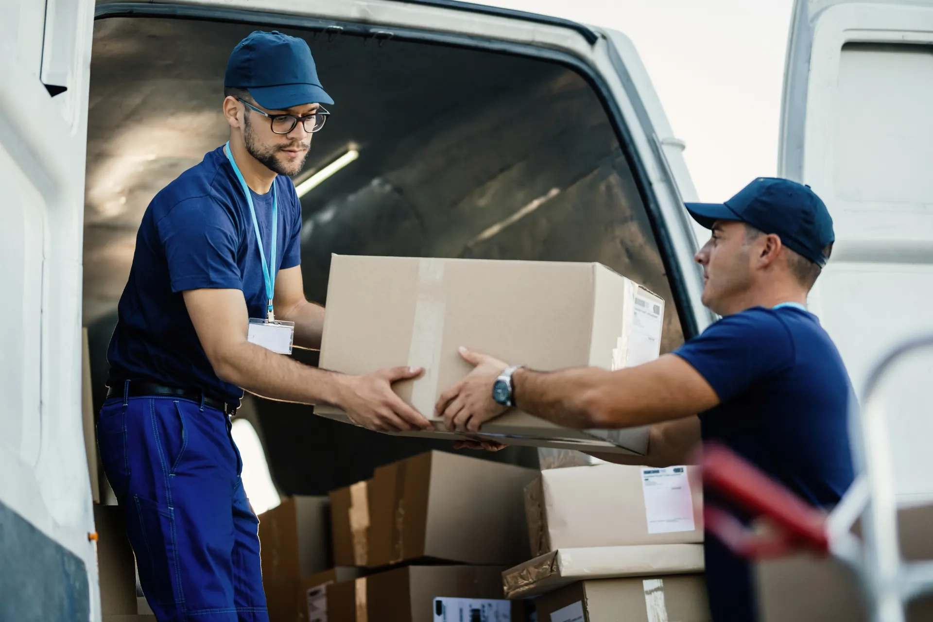 M3 Movers team loading boxes into a moving van