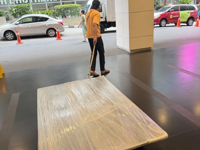 Wrapped table ready to move through a building lobby
